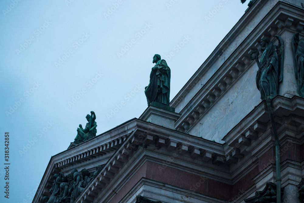 statues standing on the building