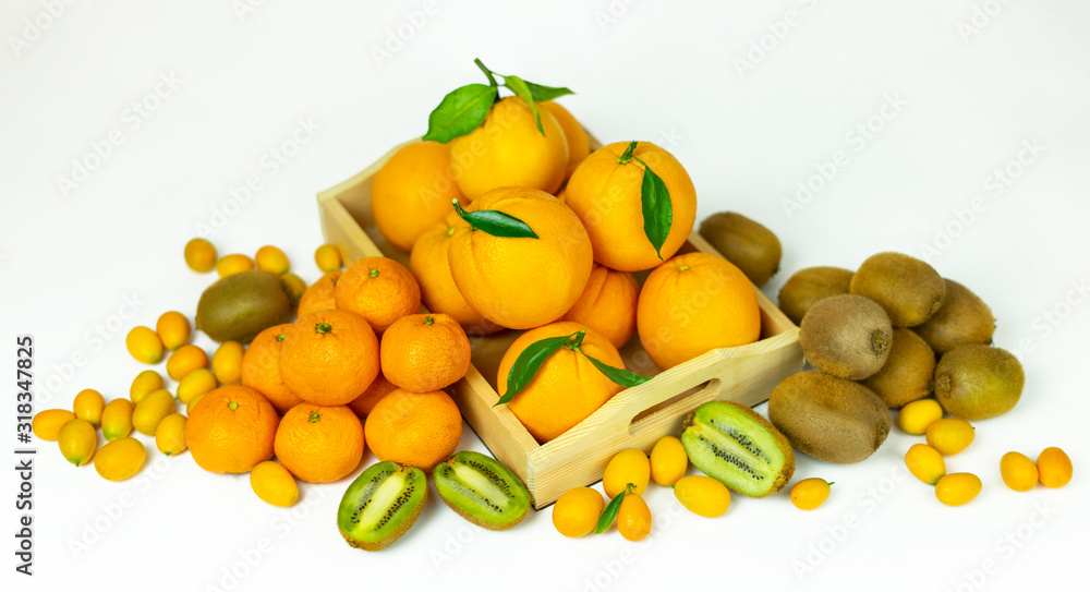 Tropical fruits in bulk: orange, mandarin, kumquat, kiwi. Fresh fruits, food on a white background.