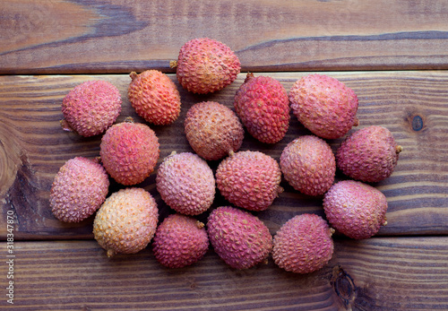 Lychee fruit on wooden background. Fresh lychee tropical fruit.