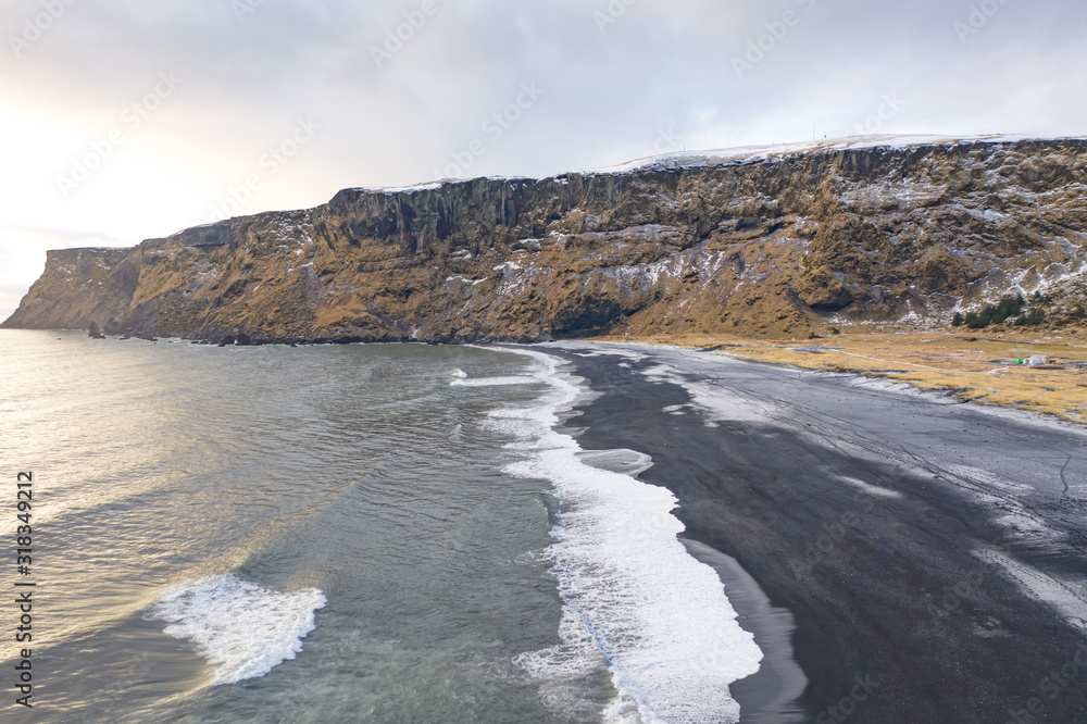 Fototapeta premium Black sand beach and cliffs in winter. Iceland