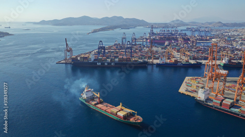 Fototapeta Naklejka Na Ścianę i Meble -  Aerial photo of industrial cargo container terminal in Perama and Drapetsona commercial port near Piraeus, Attica, Greece