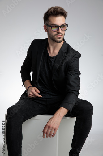 sexy cool guy wearing black coat and sunglasses © Viorel Sima
