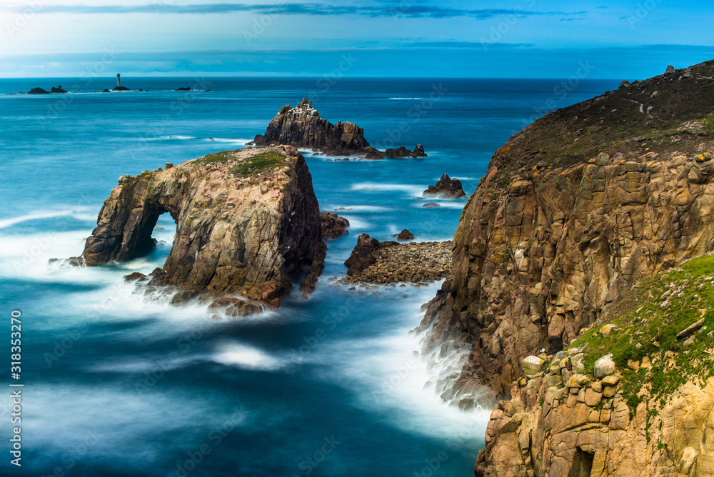 Enys Dodnan and the Armed Knight rock formation in Lands End, Cornwall, UK Enys Dodnan and the Armed Knight rock formation in Lands End, Cornwall, UK