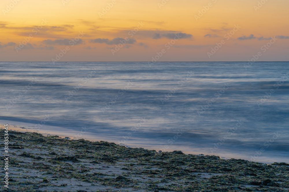 Langrune-Sur-Mer, France - 08 15 2019: Beautiful sunset on the sea