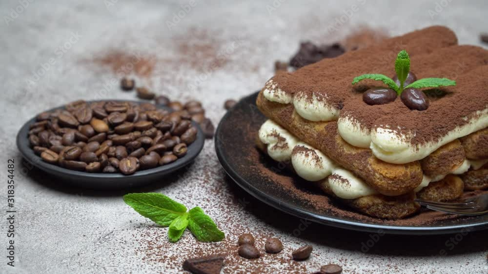 Classic tiramisu dessert on ceramic plate on concrete background Classic tiramisu dessert on ceramic plate on concrete background
