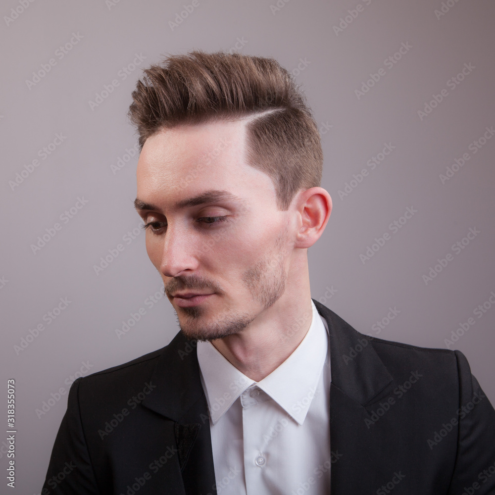 Handsome young elegant man studio portrait. Handsome young elegant man studio portrait.