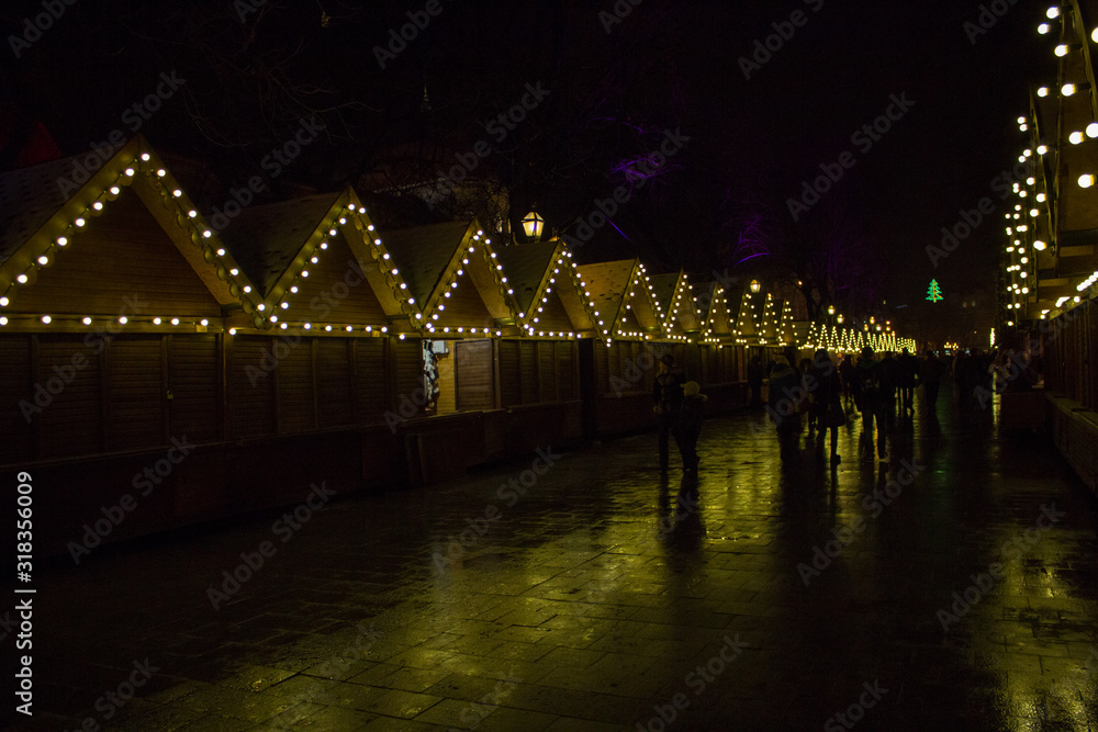 Fototapeta premium closed Christmas fair night,end of christmas holidays closed fairs at night