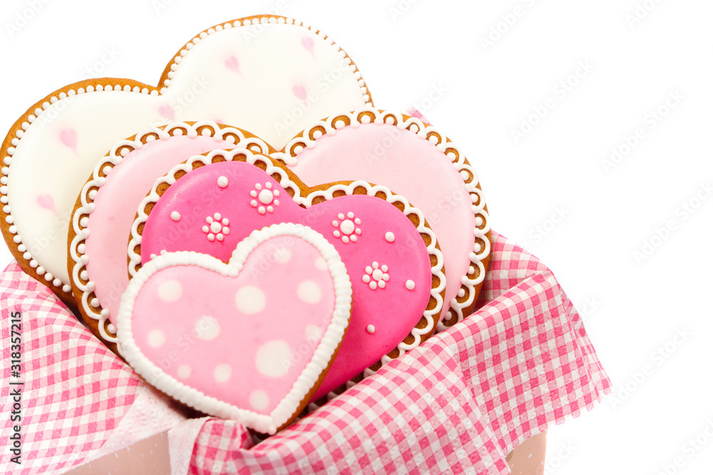 Set of pink heart shaped cookies with patterns, handmade, light background