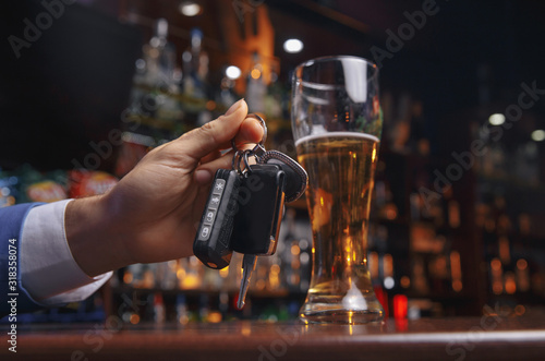 Fotografie Do not drink and drive Cropped image of drunk man talking car keys