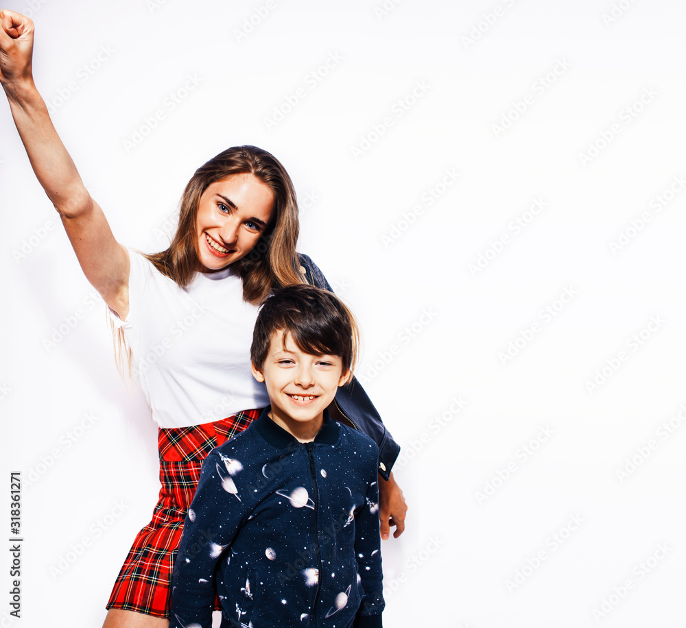 lifestyle and people concept, little cute boy with teenage girl posing together cheerful happy smiling isolated on white background