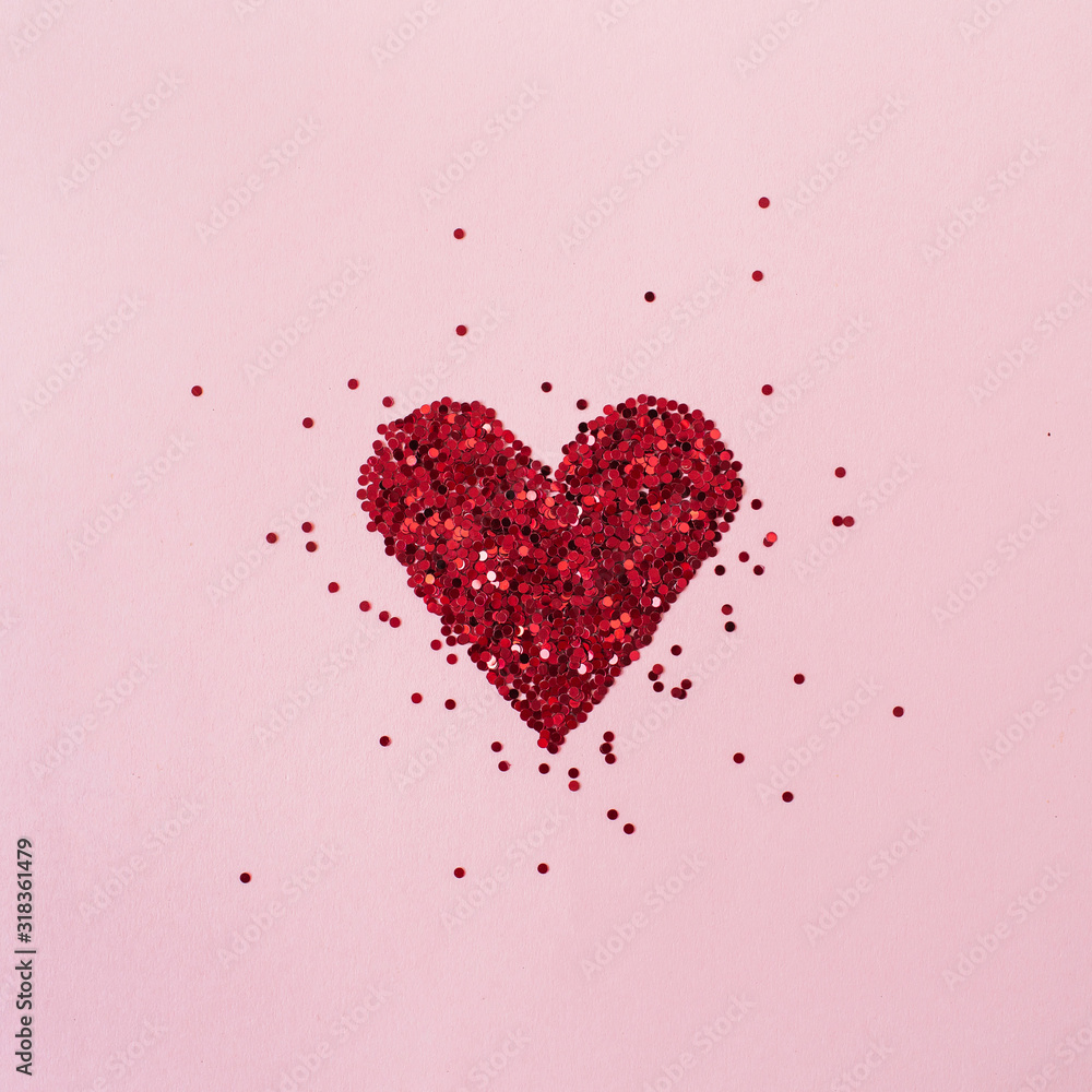 Heart symbol made of sparkles on pink background. Flat lay, top view Valentine's Day minimal holiday concept. Heart symbol made of sparkles on pink background. Flat lay, top view Valentine's Day minimal holiday concept.