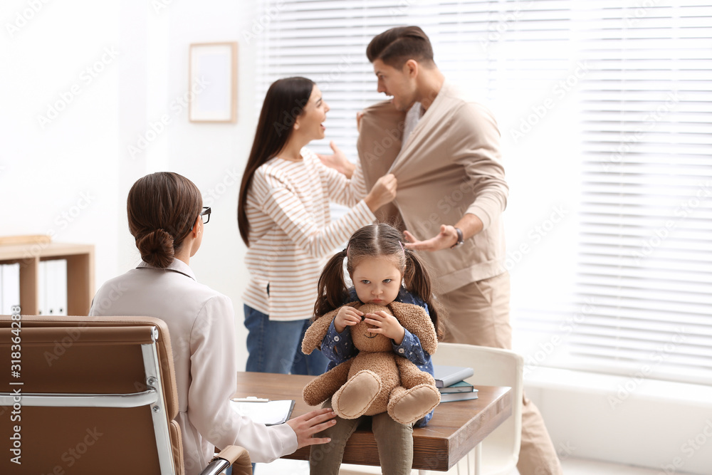 Professional psychologist working with family in office Professional psychologist working with family in office