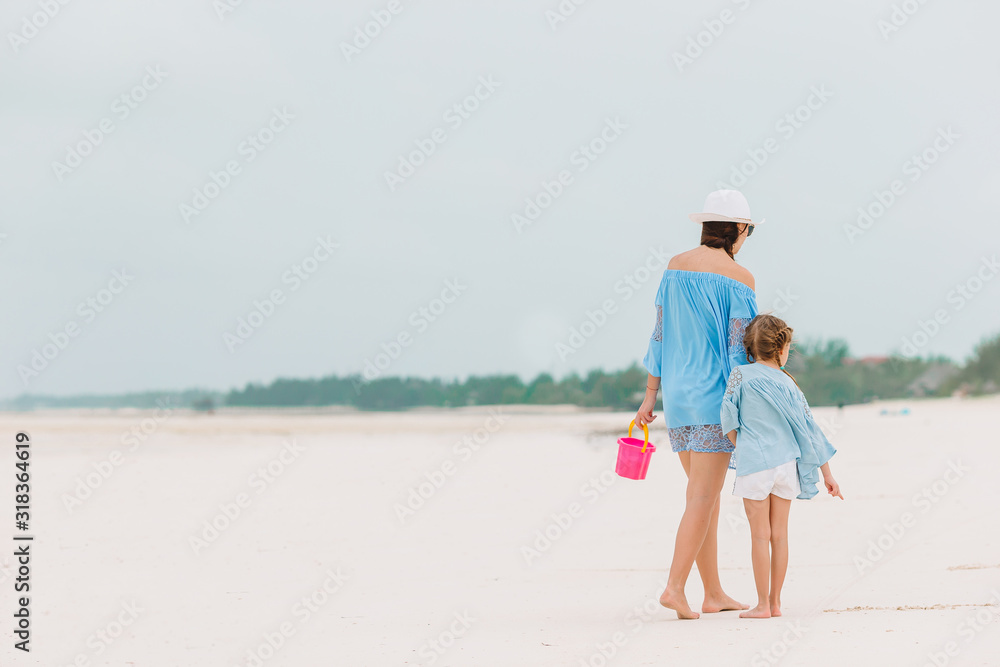 Portrait of little girl and mother on summer vacation Portrait of little girl and mother on summer vacation