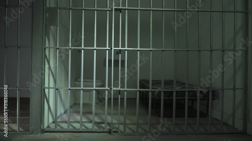 Empty Prison cell & Jail door. Camera Dolly Shot in Cellblock with no people or prisoners.