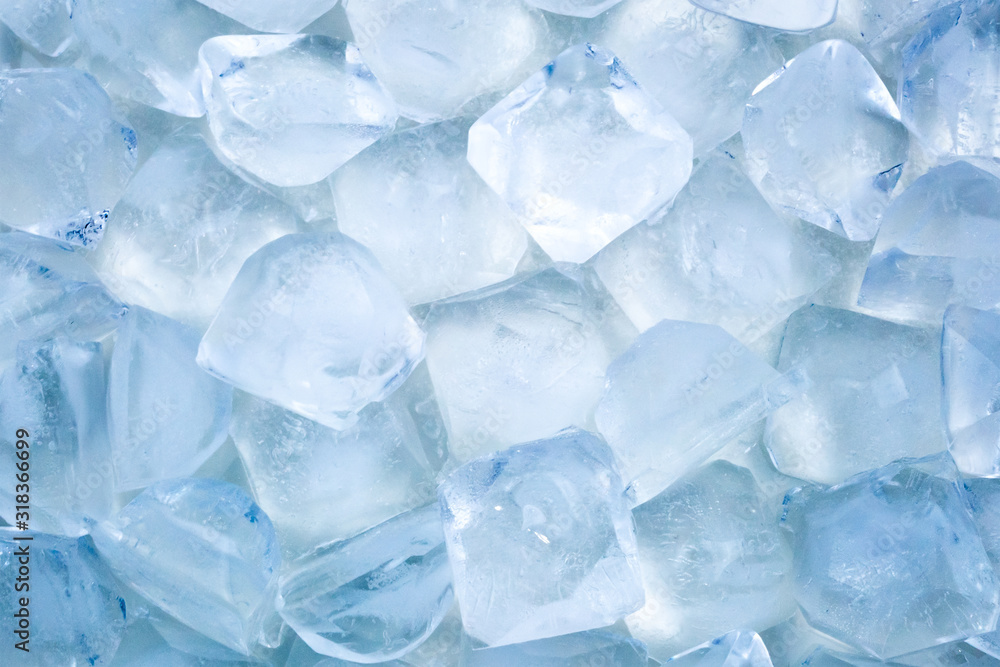 Ice cubes background texture with soft blue glowing