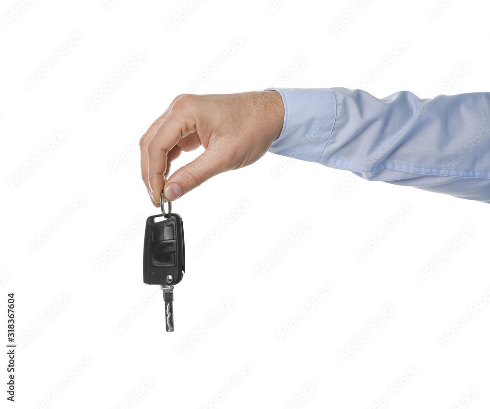 Man holding key on white background, closeup. Car buying Man holding key on white background, closeup. Car buying