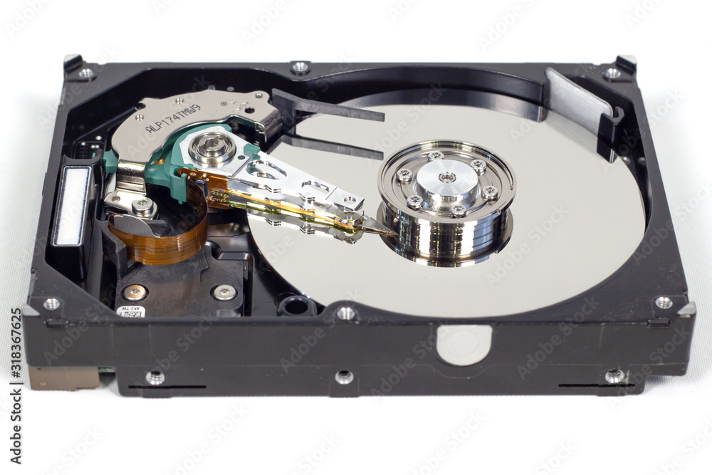 Disassemble a hard drive from a computer, a hard drive with a mirror effect a hard drive from a computer, a hard drive with a mirror effect Part of a computer, close-up HDD Disassemble a hard drive from a computer, a hard drive with a mirror effect a hard drive from a computer, a hard drive with a mirror effect Part of a computer, close-up HDD