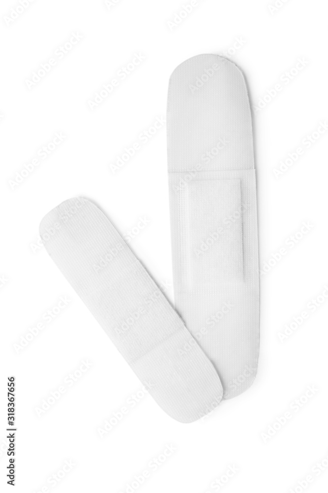 Medical sticking plasters isolated on white. First aid item Medical sticking plasters isolated on white. First aid item