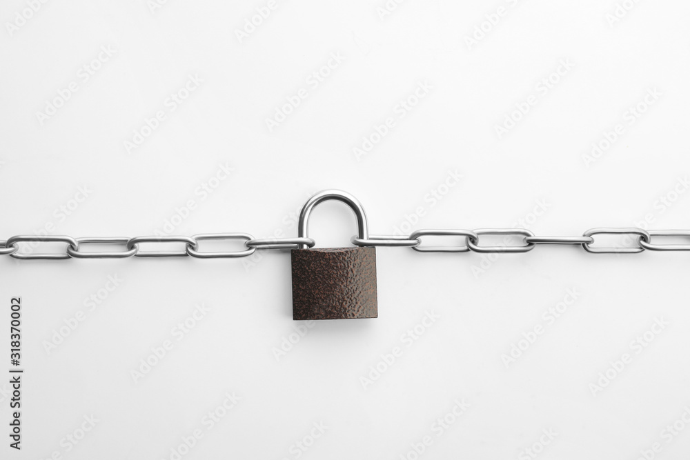 Steel padlock and chain isolated on white, top view. Safety concept Steel padlock and chain isolated on white, top view. Safety concept