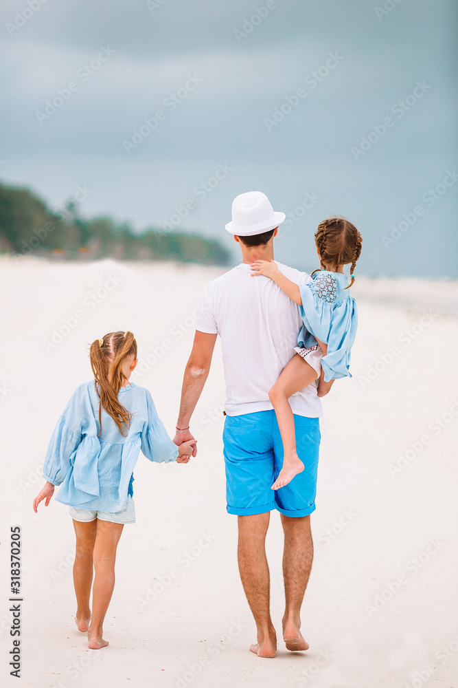 Father and kids enjoying beach summer vacation Father and kids enjoying beach summer vacation