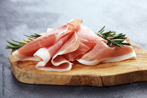 Tableau sur toile Dry Spanish ham, Jamon Serrano, Bellota, Italian Prosciutto Crudo or Parma ham