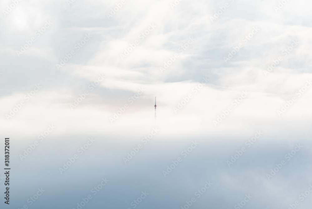 cell tower in the mountains above the clouds lighthouse minimalist concept empty space text ad