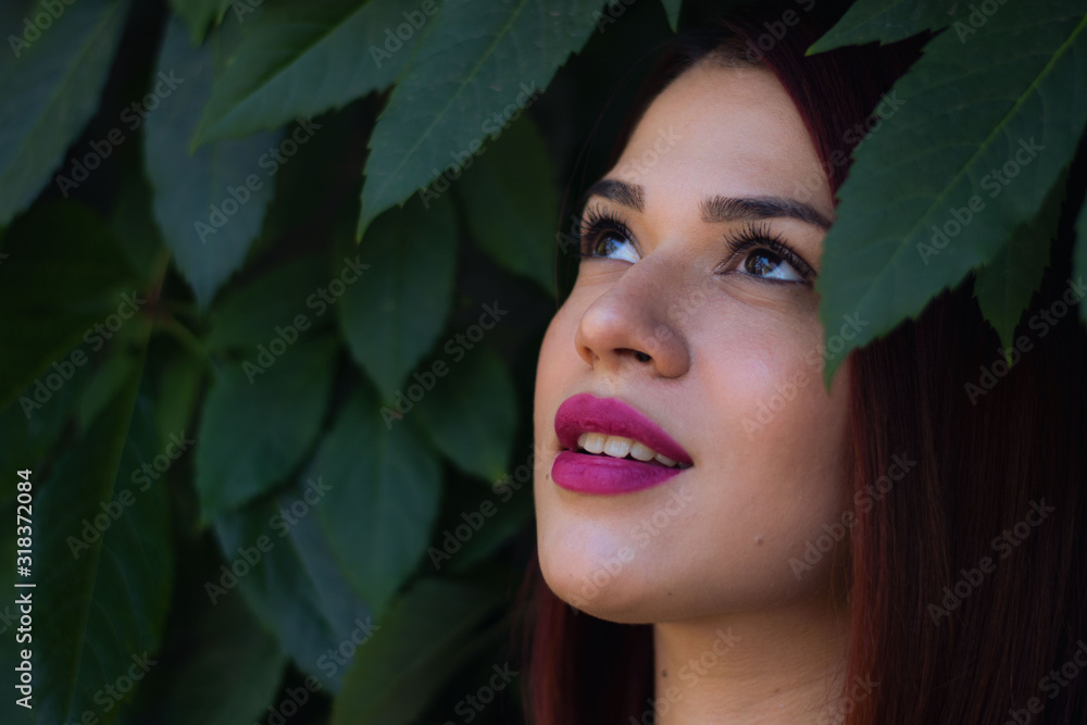 young woman posing dressed in yellow on a green background young woman posing dressed in yellow on a green background