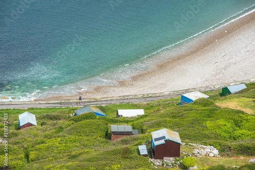 Chesil Beach with beach huts, Dorset, England. photo