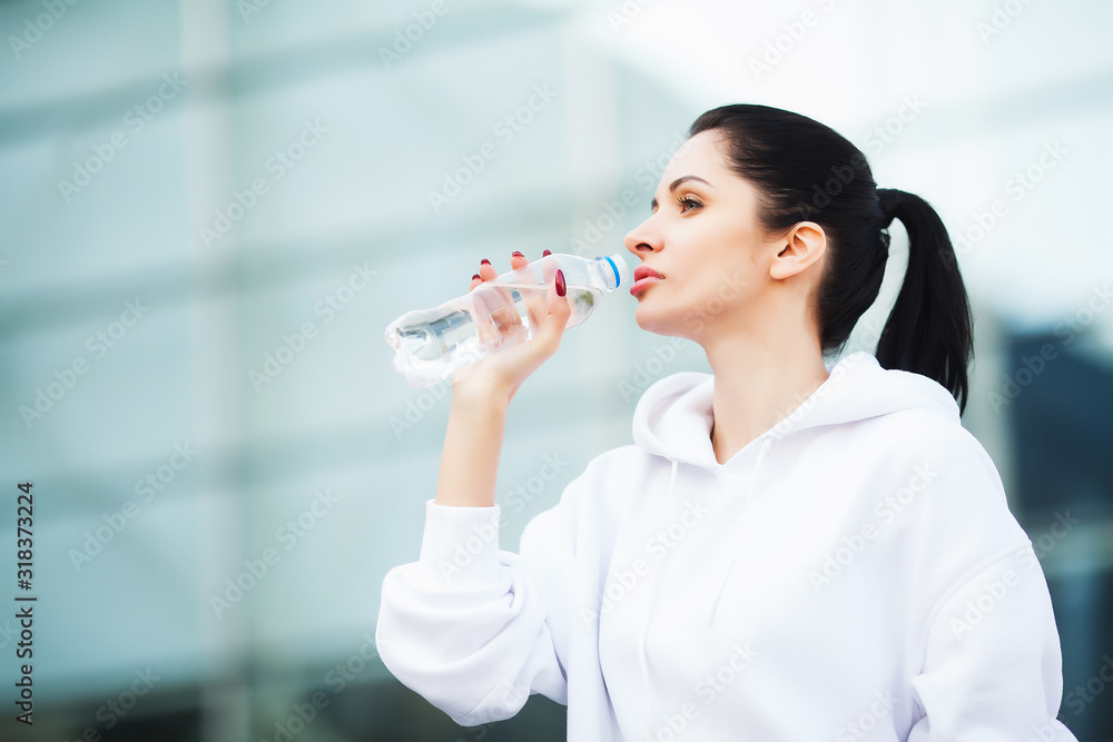 Sport outdoor. Woman Drinking Water After Running Sport outdoor. Woman Drinking Water After Running