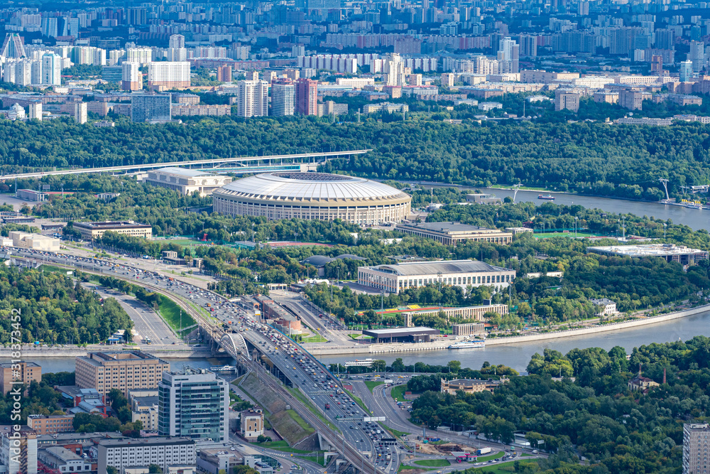 View of Moscow from a height. The capital of Russia on a summer day. Sparrow hills. Heavy traffic on the streets. Urban landscape. Travel to Moscow in summer.