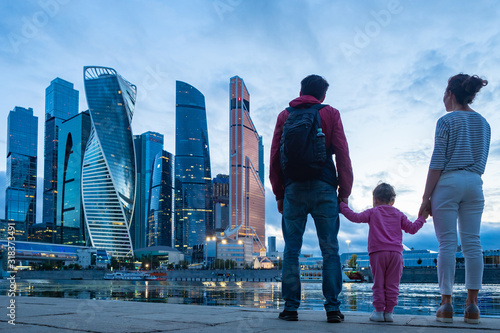 Family looks at the skyscra...