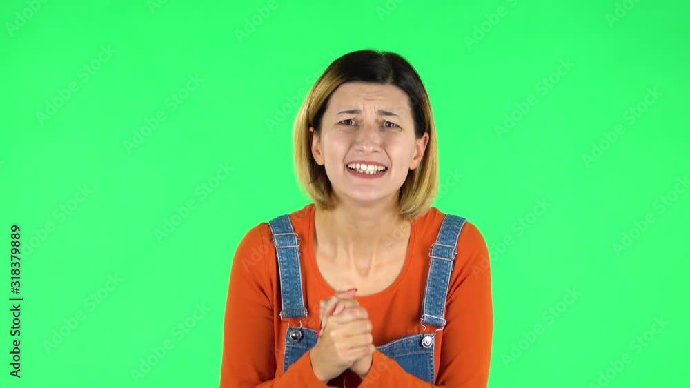 Cute female looking at the camera with excitement, then celebrating her victory triumph. Green screen Cute female looking at the camera with excitement, then celebrating her victory triumph. Green screen