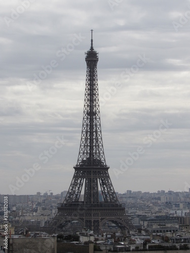 View of the Eiffel Tower as seen from the Arc de Triomphe in Paris, France on a cloudy day © Isabel
