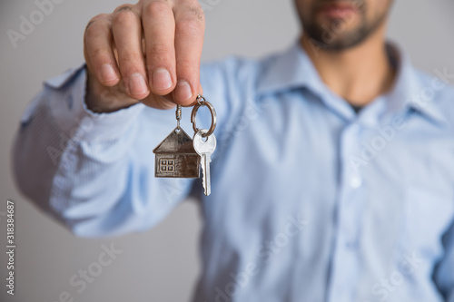 man hand house key