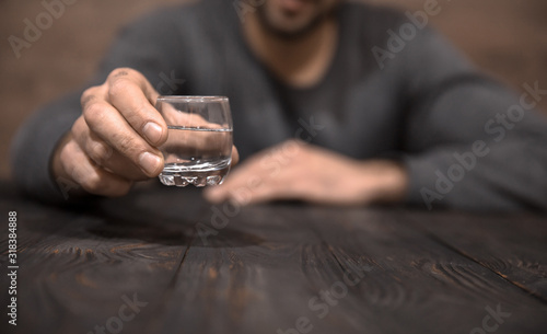 man hand glass of vodka