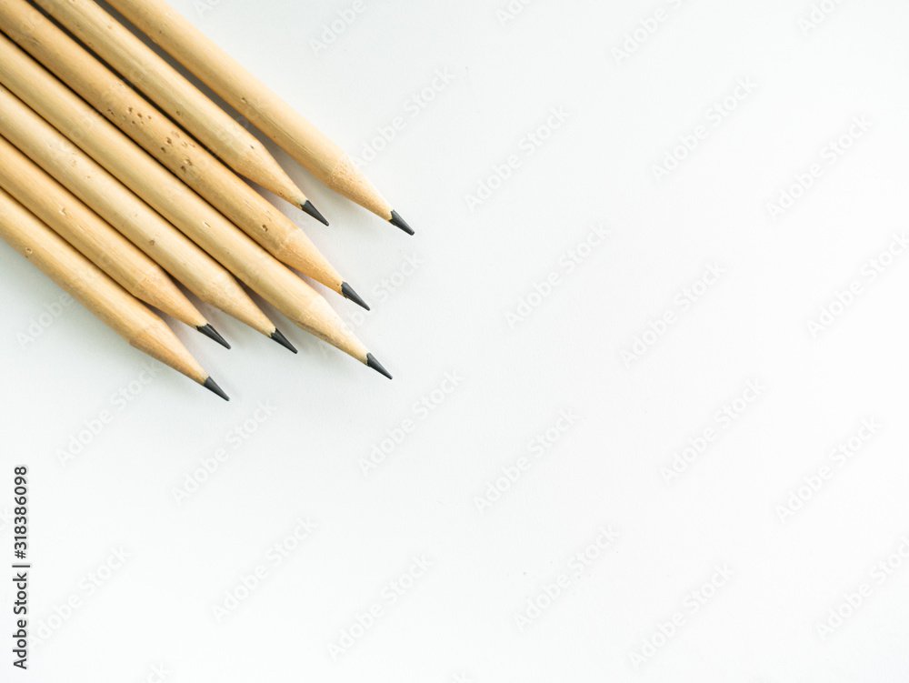 Minimal wooden brown beige pencil of community, student, worker group or competitor challenge in one focus concentrate their business company object stationery on isolated desk white background Minimal wooden brown beige pencil of community, student, worker group or competitor challenge in one focus concentrate their business company object stationery on isolated desk white background