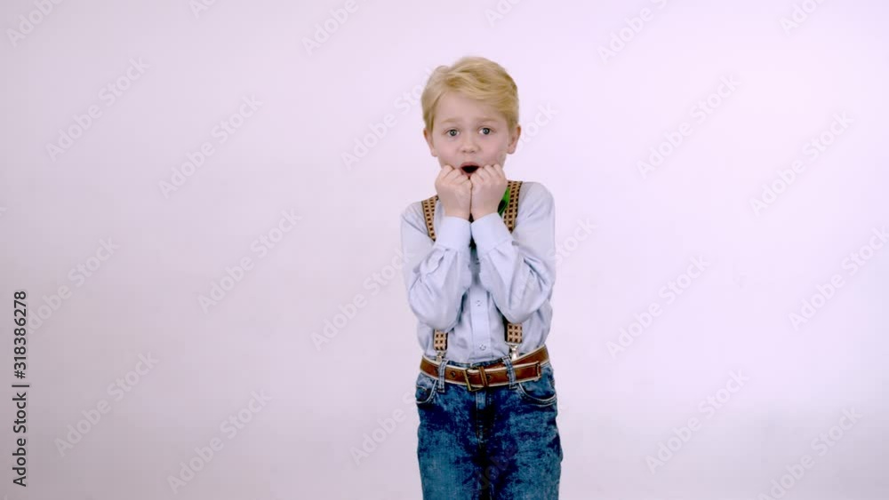 Boy blond makes a surprised face Boy blond makes a surprised face