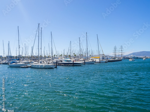 Bay with yachts and ships off the coast of Spain