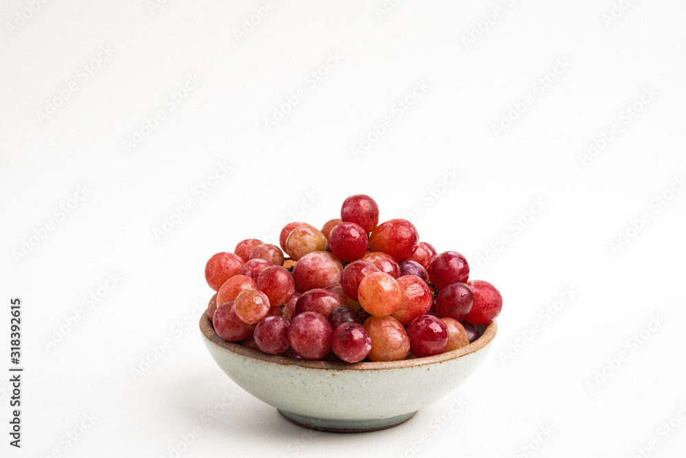 Red Grapes In Small Round Ceramic Bowl Red Grapes In Small Round Ceramic Bowl