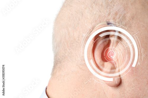 Senior man with hearing aid...