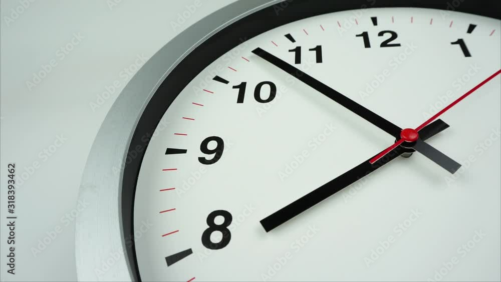 Eleven o'clock Gray wall clock on White background. Eleven o'clock Gray wall clock on White background.