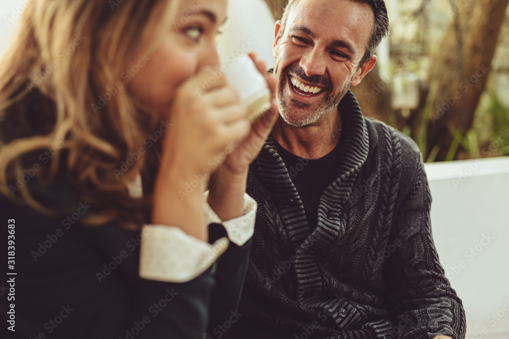 Happy couple sitting at coffee shop Happy couple sitting at coffee shop