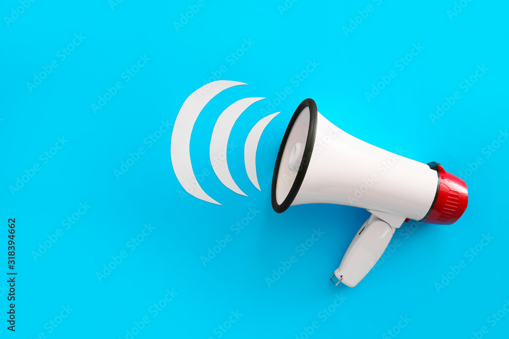Modern megaphone on color background Modern megaphone on color background