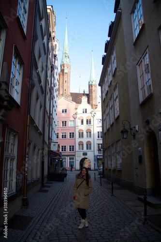 Full Length Of Woman Standing On Street Amidst Buildings © natalya zyryanova/EyeEm