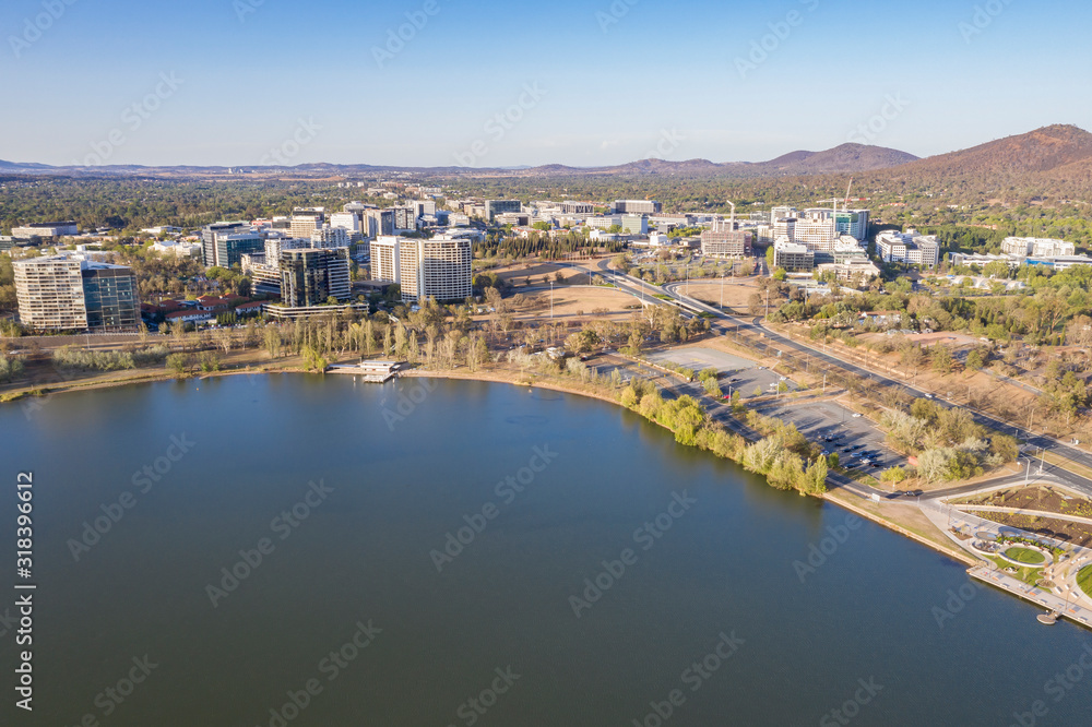 Panoramic aerial view of Canberra City looking north over Lake Burley Griffin with the Ovolo Nishi building, NewActon South Building and BreakFree Capital Tower 