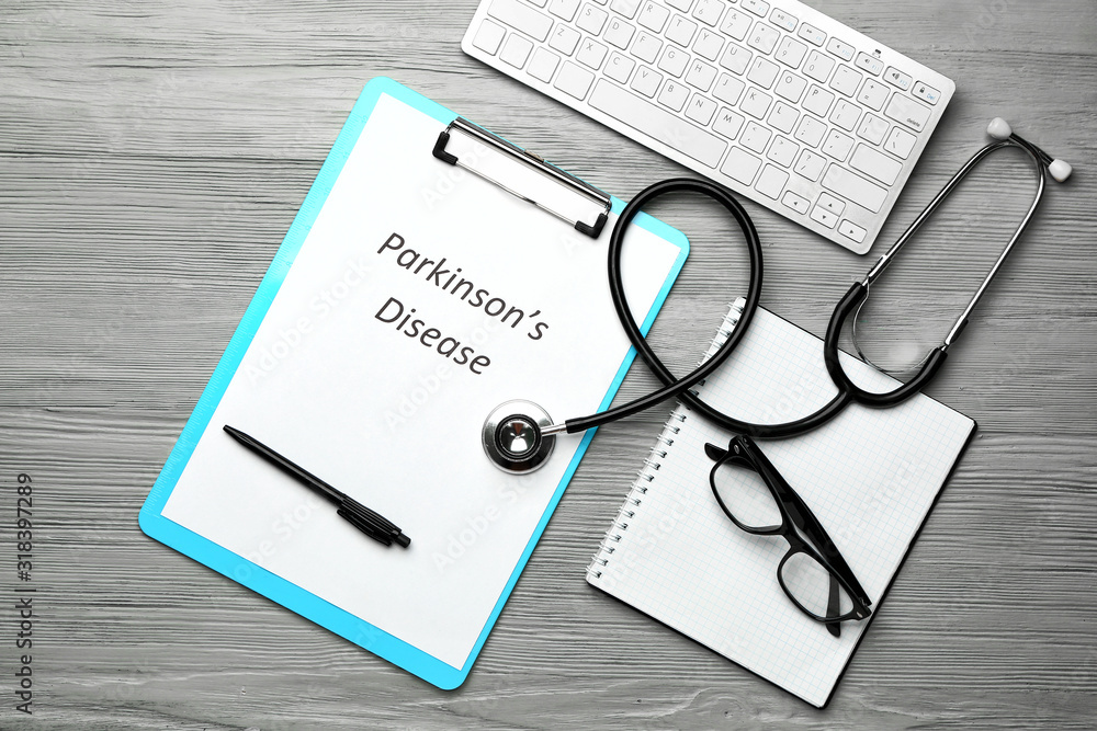 Clipboard with text PARKINSON'S DISEASE, stethoscope and computer keyboard on wooden background Clipboard with text PARKINSON'S DISEASE, stethoscope and computer keyboard on wooden background