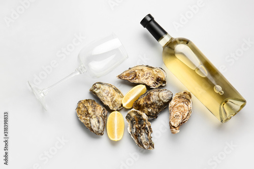 Tasty oysters with wine on ...