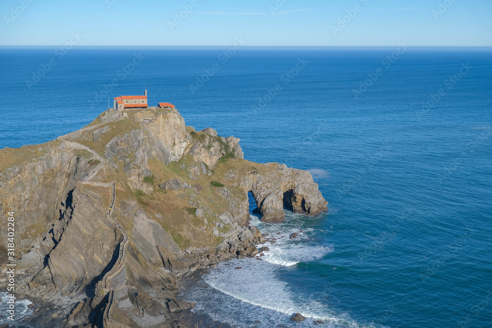 A amazing island off the Atlantic coast of Spain with an ancient monastery on top. A beautiful place for filming in adventure films and TV shows. San Juan de Gaztelugatxe, Basque Country, Spain.
