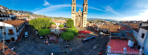 Taxco, Mexico-December 22, 2019: Panoramic view of Church of Santa Prisca de Taxco (The Parroquia de Santa Prisca) in the central plaza of Taxco historic center photo