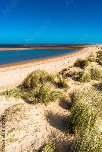 Sand dunes where Norfolk Coast path National Trail from Barnham Overy Staithe reaches the sea. East Anglia, England, UK.